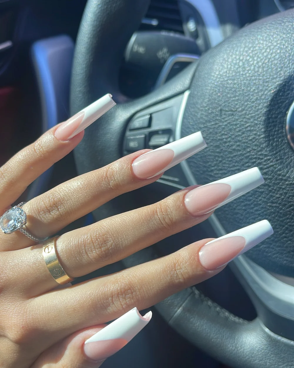 Modern white French sculpted nail extensions